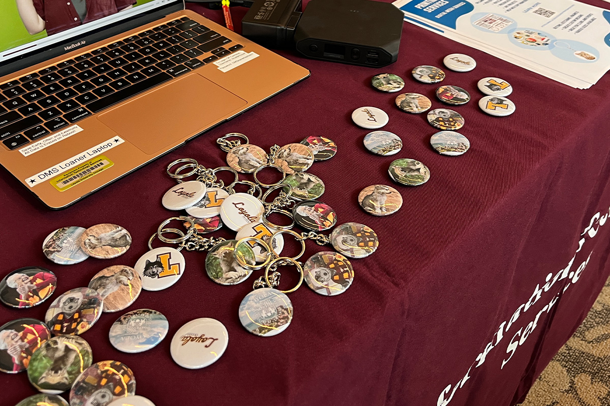 Pin-backed buttons and magnets at a departmental resource fair table